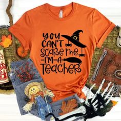 Orange Shirt With Black Print Teacher Halloween Shirts, Teacher Halloween, Halloween Graphic Tees, Teachers Halloween, Halloween Graphic, Orange Shirt, Halloween Shirts, Black Orange, Black Print