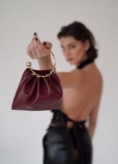 Charming and versatile, this Gold-Plated Ring Handle Bag can be styled for your perfect evening dinner outfit! No matter the style of wear, the soft leather is a bronze example of quality. 100% Cow Leather. Size Length: 21cm Height: 17cm Handle Diameter: 11.5cm Weight: 200g Shipping & Return Free US shipping on orders over $100.Free International shipping on orders over $300. For more details click HERE. Evening Dinner Outfit, Burgundy Ring, Ring Handle Bag, Evening Dinner, Dinner Outfit, Ring Handle, Dinner Outfits, Plated Ring, Gold Plated Rings