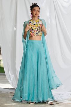 Blue blouse featuring botanical floral hand embroidered in sequin, bead and thread work. - Aza Fashions Blue Sleeveless Blouse Piece For Summer, Sleeveless Blue Blouse Piece For Summer, Summer Embroidered Georgette Choli, Silk Choli For Designer Summer Wear, Blue Silk Choli With Floral Embroidery, Embroidered Silk Choli For Summer, Summer Designer Silk Choli, Designer Wear Blue Tops With Floral Embroidery, Summer Silk Embroidered Choli