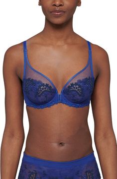 Vibrant blue embroidery veils the sheer tulle cups of this captivating, French-designed bra that's fashioned to give the illusion of a demi cup silhouette. Lined Polyester/nylon/elastane Hand wash, line dry Imported Lingerie Fitted Blue Bra With Lace Closure, Elegant Blue Lace Bra, Elegant Fitted Blue Bra, Blue Lace Push-up Bra, Blue Lace Bra With Removable Pads, Demi Cup, Simone Perele, Plunge Bra, Blue Embroidery