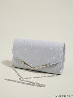 BagForLove - Stylish Metal Edge Evening Clutch Purse - Glitter Envelope Handbag with Detachable Chain Strap Product Description Color Silver Details Glitter Strap Type Chain Pattern Type Plain Style Glamorous Bag Size Small Type Square Bag Closure Type Flap Material Glitter Composition 100% Polyester Size Chart INCH CM Bag Height Bag Length Bag Width Strap Length 5.5 inch 9.4 inch 2 inch 47.2 inch Bag Height Bag Length Bag Width Strap Length 14 cm 24 cm 5 cm 120 cm Details Pictures Similar Products h2 { text-align: center; } /* æ¢è¡ */ li{ white-space: normal; word-break: break-all; word-wrap: break-word; } .red-box { width: 100%; display: flex; flex-direction: row; flex-wrap: wrap; justify-content: center; } .red-box > div { width: 190px; height: 250px; margin: 10px; } .red-box > div > Formal Purse Evening Bags, Prom Bag Silver, Purses For Hoco, Silver Clutch Bag Prom Purses, Cute Clutch Purse, Silver Bag Prom, Silver Bags For Prom, Silver Clutch Purse Prom, Silver Prom Bag