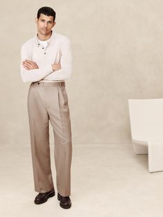 This relaxed pant is expertly cut with a wide leg and puddle hem from an Italian wool fabric we love for its subtle twill texture.  Designed to carry you through all seasons, this beautiful fabric is woven in a Super 120's weight--the perfect balance of fine handfeel, beautiful drape, and everyday durability.  Wrinkle-Resistant, Breathable, Stretch Mid rise.  Wide leg with extra length for a break at the hem Fabric from Italy's Lanificio Guabello.  Zip-fly with button closure.  Belt loops.  Four-pocket styling.  Wide-leg fit: High rise.  Tailored for the at-ease fit of traditional trousers, but with the extra wide-leg and full length of puddle-hem pants.  Wide leg opening measures 10" flat.  Inseams: Short 28. 5", Regular 30. 5", Tall 33. 5" Model: Size 32 Regular, 6'2" (188cm). Mens Trousers Fashion, Suit Pant, How To Hem Pants, High Rise Pants, Khaki Color, Dressy Casual, Bottom Clothes, Wool Fabric, Mens Trousers