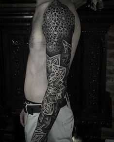 a man with a tattoo on his arm