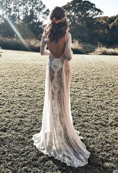 the back of a woman's dress in an open field