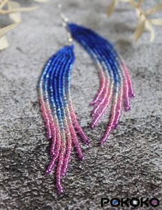 Blue Beaded Chain Earrings For Party, Long Drop Beaded Earrings For Party, Party Long Drop Beaded Earrings With Ear Wire, Pink Party Earrings With Tiny Beads, Festival Blue Chandelier Earrings With Colorful Beads, Blue Colorful Beaded Dangle Earrings, Pink And Purple Beaded Earrings, Blue Beaded Fringe Drop Earrings, Blue Hand-strung Beaded Earrings