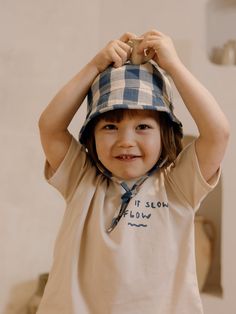 Our cute sun hats are meant for playful summer days filled with friends, laughter, and sunshine! 100% organic muslin cotton, 130g This hat is our favourite this season. In a classic shape featuring our NEW chunky gingham pattern, it is perfect for all the pool adventures or splashing in the sea. Add a pair of sandals, and your baby is ready to play in the sand for hours! Wear it with our matching gingham pieces for a coordinated look, or mix and match for playful outfits. Designed in the UK. Mad Cute Summer Hats For Playtime, Spring Cotton Sun Hat For Playtime, Spring Playtime Cotton Sun Hat, Cotton Sun Hat For Spring Playtime, Cute Summer Sun Hat For Playtime, Cream Cotton Summer Sun Hat, Cute Cotton Bucket Hat, Summer Cotton Sun Hat For Playtime, Blue Summer Sun Hat For Playtime