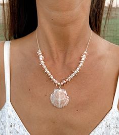 "Glam up your beach wedding or favorite summer dress withthis feminine elegant shell necklace that is perfect for a beach wedding!  It is made with a genuine scallop shellplucked directly from the shores of the Gulf Coast (by yours truly), and it is embellishedwith shell chip beads and freshwater pearl beads.  The necklace is strung on high-quality, durable,natural cream-colored hemp cord and measures 16-18\" in length (with adjustablechain extender).  The center shell measuresapproximately 1\" Cheap Elegant Shell Necklaces, Cheap Shell Necklace For Festivals, Cheap Shell-shaped Necklaces For Vacation, Luxury Bohemian Shell Necklace For Beach, Cheap Shell Necklace For Festival, Cheap Colorful Beaded Shell Necklace As Gift, Beach Shell Necklace Made Of Mother Of Pearl, Pearl Shell Necklace For Vacation, Vacation Pearl Shell Necklace