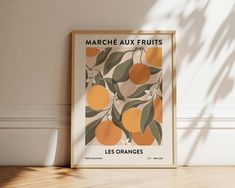 an orange fruit poster hangs on the wall