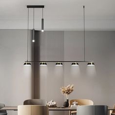 an elegant dining room with modern lighting fixtures and chairs in neutral colors, including beige