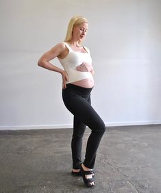 Discover the epitome of versatility and comfort with Around April's Work Straight-Leg Maternity Pants. Crafted from a premium blend of viscose, nylon, and Lycra, these pants are designed to move with you—offering the perfect fit at every stage of your pregnancy. Featuring a full length straight cut leg that looks great in heels or joggers. The unique high-back and low-front cut ensures the waistband stays in place whether you choose to fold it down or up for added support (pictured worn both way Versatile Bottoms For Pilates, Versatile Fitted Pants For Pilates, Fitted Bump Friendly Bottoms For Pilates, Ankle-length Fitted Yoga Pants, Fitted Tapered Leg Yoga Pants, Stretch Straight Leg Pants For Pilates, Fitted Yoga Pants With Tapered Leg, Stretch Tapered Leg Bottoms For Yoga, Black Fitted Maternity Bottoms