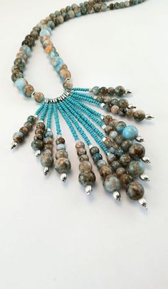 ❤Before completing your purchase, please, read carefully about delivery times for your country and keep in mind that delivery delays may happen due to the pandemic situation and the consequent decrease in the number of flights worldwide. So pretty and stylish jewelry! A delicate long boho necklace beaded with high-quality glass beads, crystals beads, metal beads, and blue tassel embroidered with crystals. It's perfect to compose any look, basic or classic, you can wear it any time. ❤IMPORTANT TO Adjustable Turquoise Tassel Necklace With Round Beads, Bohemian Turquoise Necklace With Dangling Beads, Adjustable Turquoise Necklace With Round Beads, Turquoise Bohemian Tassel Necklace, Turquoise Beaded Tassel Necklace With Round Beads, Turquoise Beaded Tassel Necklace, Long Boho Necklace, Long Necklace Boho, Crystals Beads