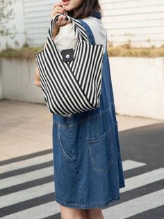 Introducing our Versatile Striped Crochet Tote Bag, the perfect companion for your everyday activities! Featuring a stylish design and sturdy construction, this bag is both fashionable and functional. With its spacious interior and durable straps, you can confidently carry all your essentials wherever you go. Upgrade your daily routine with this must-have bag! Color : Black and White Magnetic : No Bag Size : Mini Style : Casual Type : Crochet Bags Closure Type : Buckle Strap Type : Double Handle Casual Handheld Satchel For Daily Use, Versatile Handheld Straw Bag For Daily Use, Summer Casual Crochet Bag With Removable Pouch, Casual Summer Crochet Bag With Removable Pouch, Versatile Straw Satchel Bag For Daily Use, Versatile Satchel Straw Bag For Daily Use, Everyday Use Bucket Satchel With Single Shoulder Strap, Everyday Bucket Satchel With Single Shoulder Strap, Casual Bucket Shoulder Bag For Daily Use