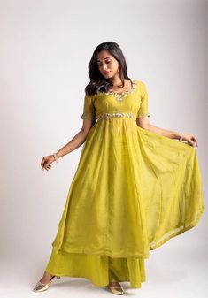 Anarkali suit usa / anarkali kurta full sleeve  / Indian dress with ombré dye/embroidered anarkali/Indian dresses / voggish / anarkali         Looking for a perfect indian dress/anarkali/suit sets that are trendy, unique and easy to carry !! yess, You are at the right place. we carry such versatile pieces of anarkalis and suit sets, kurtas that really let you stand out in any occassion !!      featuring this beautiful light mehendi green anarkali that has hand embroidery all over at the body and sleeves as shown paired with loose Polazzo / sharara pants as shown !! A very classy, beautiful yet unique look makes your occasion so Perfect !! Ready to ship in USA !! perfect for mehendi wedding outfit , can be customized in colors and patterns !! Details :  - color : light mehendi green   - Dre Pista Green Straight Kurta With Gota Work, Pista Green Dress With Gota Work, Green Anarkali Palazzo Set With Sheer Dupatta, Green Anarkali Dress With Zari Work, Anarkali Pista Green Sharara With Mirror Work, Green Anarkali Chanderi Dress, Pista Green Anarkali Sharara With Mirror Work, Designer Pista Green Dresses With Zari Work, Pista Green Anarkali Dress In Georgette