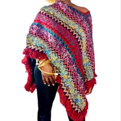 Multi Color Fringe Hem Knit Poncho, Fall Weather Ready, Stay Warm In This Multicolor Tribal Print Poncho Shrug Sweater. One Size Fits Most. Multicolor Yarn Shawl, Red Long Sleeve Poncho, One Size, Red Bohemian Knit Sweater, Red Bohemian Sweater For Winter, Bohemian Red Winter Sweater, Red Bohemian Winter Sweater, Red Knitted One Size Sweater, One Size Red Knitted Sweater, Red Bohemian Poncho For Winter