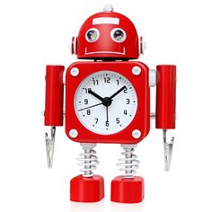 a red robot clock sitting on top of a white table