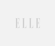 the word ellie is written in white on a plain background with black and white lettering