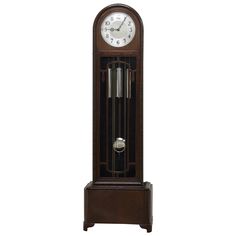 an antique grandfather clock with pendulums on the front and sides, isolated against a white background