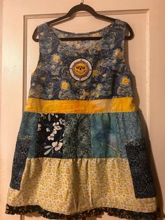 This is a one-of-kind handmade short patchwork dress. The fabric is 100% cotton, prewashed; blues and yellows. Jasper Sun patch and 2 side pockets. Fits women's M Hippie Cotton Dresses With Floral Patchwork, Blue Cotton Patchwork Dress, Blue Patchwork Hippie Dress, Upcycled Blue Cotton Dress, Blue Hippie Patchwork Dress, Summer Patchwork Dress In Upcycled Fabric, Patchwork Dress, Sun Dress, Dress Clothes For Women