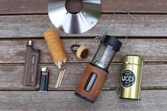 the contents of a coffee grinder and other items laid out on a wooden table