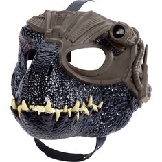 a plastic dinosaur mask with spikes on it