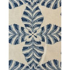 a blue and white fabric with large leaves on it