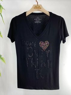 Sparkle and Fun! This is tee is a must! Made with excellent material, this shirt is made to last! The sparkling on it is soooo beautiful! I'm sure you will love it! Black Embellished Cotton T-shirt, Casual Embellished T-shirt, Trendy Short Sleeve T-shirt With Glitter Print, Black Cotton T-shirt With Glitter Print, Party T-shirt With Rhinestones And Short Sleeves, Casual Embellished T-shirt For Party, Embellished Cotton Short Sleeve T-shirt, Cotton Embellished Short Sleeve T-shirt, Black Short Sleeve T-shirt With Glitter Print