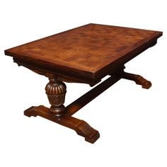 an old style wooden table with two legs and a square top on the base is made out of wood