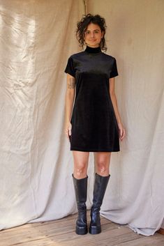 PLEASE SEE EXACT MEASUREMENTS BELOW DESCRIPTION, FOR PRECISE FIT Vintage Sostanza Contemporary Apparel Black Velvet Mock Neck Mini Dress. Beautiful black velvet mini dress, with a high turtle neck. Simple classic shape. The neck/head hole is narrow to put over the head, has a little stretch to help - but it is snug. Made from polyester & spandex. Labeled a size Medium. Estimated fits like a modern size SMALL/ MEDIUM.  In excellent condition. MEASUREMENTS  Measured laying flat: Chest - 36" Waist - 36" Hip - 40" Shoulder - 14" Sleeve - 6" Length - 34" Product Details Era: Y2K Label: Sostanza Contemporary Apparel  Color: Black Material: 94% Polyester 6% Spandex  Size: Labeled Medium, fits like a modern SMALL/MEDIUM Pockets: No Shown on a 5'6" model with measurements of 32"-25"-37" (bust, wais Black Velvet Mini Dress, Vintage Velvet Dress, Mock Neck Mini Dress, Dress High Neck, Velvet Mini Dress, Mini Velvet Dress, Vintage Velvet, Small Dress, Flat Chest