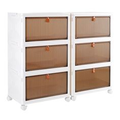 the four drawers are white with brown rattans on each side and two orange handles