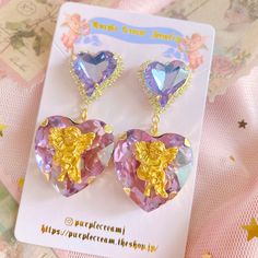 Purple Cream Jewelry original design earrings


 
Cute earrings with large heart jewels♪

 The heart at the bottom has an angel motif.

 Recommended for those who like Korean fashion ♡



 *Depending on the type of light, the purple colored jewels may appear clear blue or purple. (See photo)

 *The parts of this product are very delicate. Please be careful not to subject them to strong impacts or pull them with excessive force.

 *These earrings are a little heavy.



 Color: Gold

 Size: Approx. 5.5cm x 2.6cm

 Weight: Approximately 28g for both ears

 Material: Zinc alloy



 As this is an imported product, please refrain from purchasing if you are sensitive or looking for perfection.



 ■About color

 Please note that the colours of the actual product may differ from those shown in th Purple Heart-shaped Pierced Earrings, Purple Heart-shaped Earrings For Pierced Ears, Purple Earrings For Valentine's Day, Purple Heart Charm Earrings For Valentine's Day, Cream Jewelry, Vision Street Wear, Angel Earrings, Large Heart, Power To The People