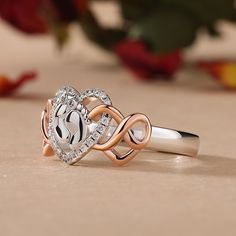 Perfect for mom or mom-to-be, this two-tone sweet ring is a lovely testament to baby love. Crafted in sterling silver, this design features two footprints wrapped in a heart frame of smaller round stones. Two rose gold tone infinite hearts linked with the top of the ring, completing this sweet design. Heart is one of the most popular design elements in jewelry. It's often related with love. Treat her with this cute ring on a special day!Carat Weight: 0.236 ctStone Size: 1,0.8 mmStone Type: Jeulia® StoneNumber of Stones: 24 Stone Shape: RoundStone Color: Diamond WhiteWeight: 3.77 gWidth: 2.7 mmHeight: 3.7 mmThickness: 1.4 mmMaterial: 925 SilverPlating Color: Silver, Rose Gold Mother's Day Promise Heart Ring In White Gold, White Gold Heart Promise Ring For Mother's Day, Mother's Day Promise White Gold Heart Ring, Silver Heart Ring For Mother's Day Promise, Personalized White Gold Heart Ring For Mother's Day, White Sterling Silver Heart Ring With Birthstone, White Heart Ring For Mother's Day, Rose Gold Sterling Silver Heart Ring For Anniversary, Personalized White Heart Cut Ring