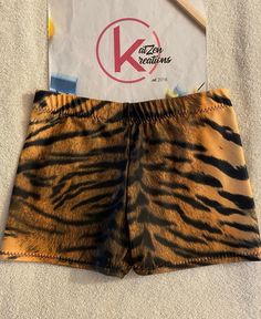 Red  Dance/Gymnastic/cheer practice shorts in great cheetah print. Made of 4-way stretch spandex fabric.  Full bottom coverage ensures that the shorts won't ride up during  the most aggressive moves.  All Shorts are handmade in the USA and are made to order. If you have specific questions about sizing you can message me and I will do my best to answer any questions you have. I always advise to go by your street size only. Care: Please wash in cold water only on a gentle cycle and lay flat to dry Summer Cheerleading Athletic Shorts, Summer Cheerleading Stretch Biker Shorts, Summer Biker Shorts For Cheerleading, Summer Dancewear Shorts With Built-in Liners, Stretch Athletic Shorts With Built-in Shorts For Cheerleading, Summer Stretch Leopard Print Shorts, Summer Dancewear Shorts, Stretch Leopard Print Shorts For Summer, Summer Stretch Shorts In Leopard Print