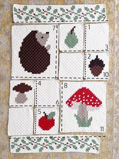 cross stitch hedges and mushrooms are shown on the side of a piece of cloth