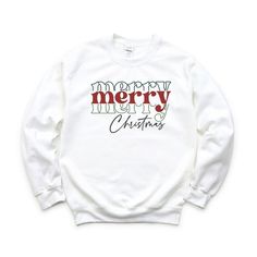 Looking for a cute versatile top to wear this summer? Make sure to grab one of our Merry Christmas Stacked Sweatshirts! This soft and comfortable shirt is the perfect top for any outfit. It can be paiWhite with biker shorts, Jeans, or the classic stay at home sweats! The bright color adds a pop of summer to any outfit. This sweatshirt is true-to-size, so be sure to order your regular size! If you are looking for a more oversized look, make sure to size up. Casual Christmas Sweatshirt With Letter Print, White Casual Christmas T-shirt, Casual White Christmas T-shirt, Casual Christmas Cotton Sweatshirt, Casual Cotton Christmas Sweatshirt, White Casual T-shirt For Christmas, Casual White T-shirt For Christmas, White Christmas Holiday Sweatshirt, Casual Holiday Sweatshirt With Graphic Print