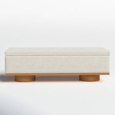 a white bench sitting on top of a wooden table