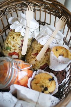 a basket filled with lots of food and utensils