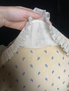 "The sweetest early 1900s beige/cream calico print day dress with white netting details. Largely great condition - netting has a few holes and the dress has a couple small storage stains, all shown in photos. I have not tried to repair or remove stains. No hooks or snap closure, so it has to slip on over your head Women's small 40\" max bust 33\" waist 40\" max hips 14.5\" shoulder to waist 33.5\" waist to hem" Vintage Beige Prairie Dress For Garden Party, Vintage Cream Prairie Dress For Garden Party, Vintage Cream Prairie Dress For Summer, Vintage Cream Victorian Dress For Summer, Cream Prairie Dress With Ruffles In Cottagecore Style, Cream Cottagecore Prairie Dress With Ruffles, Cream Vintage Victorian Summer Dress, Cottagecore Cream Prairie Dress For Garden Party, Vintage Cream Prairie Dress For Daywear