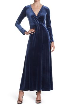 The Rosalie is a glamorous velvet maxi dress that's sure to turn covetous heads wherever you go. 57" length (size S) Surplice neck Long sleeves Back zip closure Lined Shell is 90% polyester, 10% spandex; lining is 100% polyester Machine wash, line dry Imported Model Stats: 5'10" height; 34" bust; 27" waist; 35" hips. Model is wearing size S. Fall Cocktail Dress, Velvet Maxi Dress, Velvet Maxi, Design Dresses, Daytime Dresses, Maxi Dress Navy, Ruffled Maxi Dress, Maxi Wrap Dress, Lace Maxi Dress