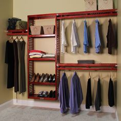 a red rack with clothes and shoes hanging on it in front of a beige wall that says home & garden essentials