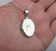 "A great gift for your significant one or for you to keep someone close to your heart, this dainty engravable photo locket necklace features: 1. a solid oval sterling silver locket (19 x 26 mm, 4.6 grams) that can hold two pictures. Both sides can be engraved with initial, short text or pictures. Photo printing and insertion service is available for extra ($14 per photo) and can be selected by the pulldown menu. Please send locket photos by attaching them to a conversation to me. Please use uncr Sterling Silver Locket Necklace, Short Text, Monogram Hearts, Engraved Locket, Picture Locket, Anniversary Necklace, Sterling Silver Locket, Photo Locket Necklace, Memory Locket