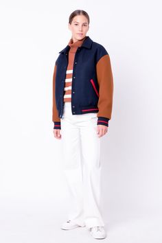 This Colorblock Bomber Jacket is a must-have item in every wardrobe. Showcasing contrast long sleeves a classic collar and front snap closure this modern jacket also features stylish side welt pockets. Crafted from quality material this jacket is perfect for a stylish on-trend look. Get the perfect fit and show off your unique style when you adorn this Colorblock Bomber Jacket. Collar Contrast long sleeves Front snap button closure Side welt pockets Ribbed Lined Hand wash cold Do not bleach Do n Fall Varsity Outerwear With Button Closure, Varsity Outerwear With Button Closure For Fall, Varsity Outerwear With Button Closure For Work, Fall Track Jacket With Contrast Panels And Long Sleeves, Fall College Sport Coat With Pockets, College Fall Sport Coat With Pockets, Navy Varsity Jacket With Pockets For Fall, Navy Varsity Outerwear For Fall, Varsity Color Block Long Sleeve Outerwear