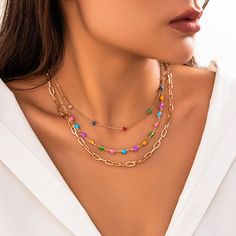 Description:Chic Layered Colorful Enamel Heart Chain Choker Necklace Set Specification:Size: 13.8" - 17.7"Weight: 0.62 oz/setMaterial: Copper. EnamelStyle: Bohemia Features & Details:This layering enamel heart chain choker necklace set is lead-free. nickel-free. cadmium-free and hypoallergenic. Don't worry about allergies to the sensitive skin or discomfort to your health. which you could wear it with confidence for a long time.This necklace set for woman is decorated with retro design and superb craftsmanship to create special piece that can satisfy any jewellery lovers. making you more attractive and charming.It is easy to match your different outfits and also suitable for any occasions like wedding. banquet. costume party. engaged party. prom. anniversary. holiday. evening party or othe Multicolor Heart-shaped Beaded Chain Necklace, Multicolor Heart-shaped Beaded Chain Jewelry, Trendy Colorful Jewelry With Heart Beads, Multicolor Necklace With Delicate Chain As Gift, Multicolor Delicate Chain Necklace Gift, Multicolor Delicate Chain Necklace As Gift, Multicolor Metal Charm Necklace With Adjustable Chain, Trendy Multicolor Metal Chain Necklace, Multicolor Chain Charm Necklace For Gifts