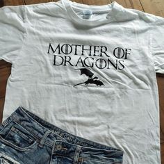 Nwot Classic, Comfy White Tee With "Mother Of Dragons" To Represent Got. Size: Adult Medium No Flaws Ships Within 48 Hours *Not Official Got Merch* Game Of Thrones Costumes, Dr Wardrobe, Mother Of Dragons, Fame Dr, White Tee, Shirt Color, Game Of Thrones, Colorful Shirts, Color White