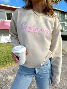 Our Sunhoney Bow Sweatshirt - Sand ﻿is our classic Sunhoney sweatshirt design with a little added bow detail. We are not even kidding when we tell you this is the perfect sweatshirt you will not want to take off! This sweatshirt features inside fleece lining, banded cuff and hem, and our classic Sunhoney logo on the front. Style this sweatshirt with basically anything and everything for the perfect, effortless look! Content: 80% Cotton 20% Polyester Fit: TTS Model wearing size: Small Model sizin Bow Sweatshirt, Choose Happy, Sweatshirt Designs, Bow Detail, Cuff, Sweatshirts, ? Logo, How To Wear, Design