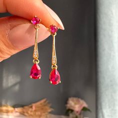 A pair of exquisite Art Deco style gold ruby earrings with 2 genuine Ruby stones on each. A perfect gift for a special occasion, such as birthdays, anniversaries or simply a treat to yourself. The earrings are crafted in 14k gold vermeil  (Sterling silver base and thick 14K gold on top), ensuring it to keep its lustre for longer. Available in 14K white gold vermeil and yellow gold vermeil. The perfect Mother's Day gift or birthday gift for her!  Also available in Emerald earrings: https://www.et Rose Gold Ruby Earrings For Gifts, Ruby Earrings For Valentine's Day, Ruby Drop Earrings As A Gift, Ruby Yellow Gold Earrings For Gift, Ruby Earrings In Yellow Gold For Gift, Yellow Gold Ruby Earrings For Gift, Gold Jewelry With Lab-created Ruby As A Gift, Ruby Earrings For Valentine's Day Anniversary, Gold Jewelry With Lab-created Ruby For Gift