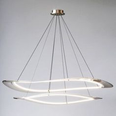 a modern chandelier with white lights hanging from it's center circle shape