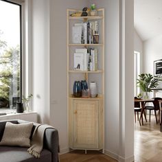 a living room filled with furniture next to a window