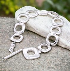 Add a touch of flair to your style with the Silver Geometric Square Link Bracelet. This gorgeous piece rocks a silver plated link chain, giving it a bold and trendy vibe. The chunky design makes it an awesome gift for her. Embrace the allure of large links and treat yourself to this fashionable accessory! ❗Bracelet with the extension will fit for 8" wrist size tight.   If you have a smaller wrist size, you can either take a link out or let me know your wrist size and we will shorten it for you. Silver Link Chain, Chunky Bracelet, Chunky Bracelets, Chain Silver, Silver Plated Jewelry, Statement Bracelet, Bracelet Silver, Pure Silver, Bracelet Gift