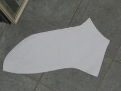 a piece of white paper sitting on top of a tile floor