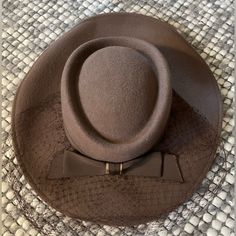 Stunning 100% Wool Hat From 1940s. Still Has The Tag On It. Features Beautiful Bow Detail And Mesh Accent. Also Has Elastic Chin Band To Hold It On. Perfect For A Tea Party Or Derby. No Size Listed Inside Space Measures 7.5” Length X 6.5” Width Vintage Formal Hat For Fall, Retro Wide Brim Felt Hat For Formal Occasions, Fitted Retro Cream Hat, Retro Fitted Cream Hat, Retro Cream Hat, Vintage Beige Felt Hat For Winter, Vintage Wide Brim Hat For Fall, Vintage Fall Hats, Retro Beige Short Brim Hat